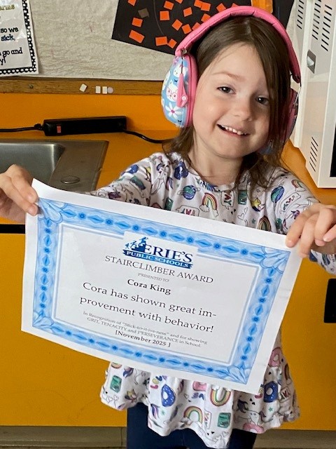 Cora King, Lincoln's Stairclimber for October, poses with his award plaque.
